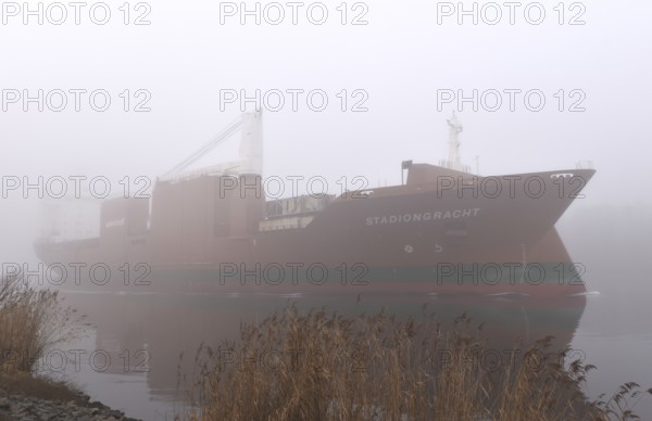 Freighter STADIONGRACHT in fog in the Kiel Canal, NOK, Kielkanal, Kielcanal, Schleswig-Holstein,
