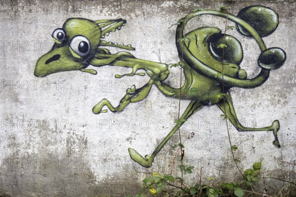 Grafity on an old wall, dilapidated plant of a former agricultural production cooperative of the