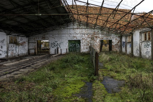Former hall, dilapidated plant of a former agricultural production cooperative of the former GDR,