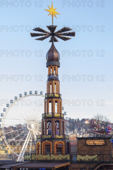 Stuttgart 2025 Christmas market on Schlossplatz with festive lights, a Christmas pyramid, mulled