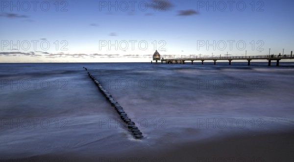 Groes and pier with diving gondola, panorama, long exposure, evening light, Zingst,