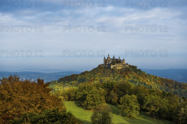 Castle and autumnal forest, Hohenzollern Castle, sunrise, Hechingen, Swabian Jura,