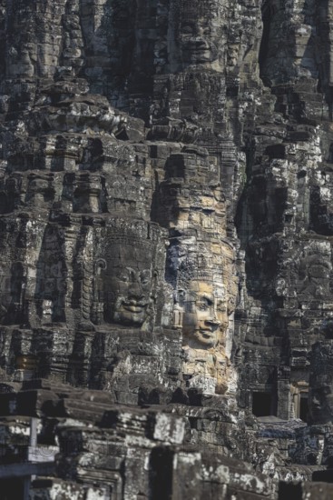 Huge stone-carved faces of Bodhisattva Lokeshvara, also Avalokiteshvara, Bayon Temple, Angkor Thom,