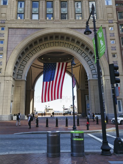 American flag fluttering, distinctive archway, Boston Harbor Hotel, Rowes Wharf, Freedom Trail,