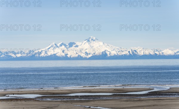Beach at Anchor Point, Cook Inlet, glaciated mountain peaks of the Aleutian Range with Mount