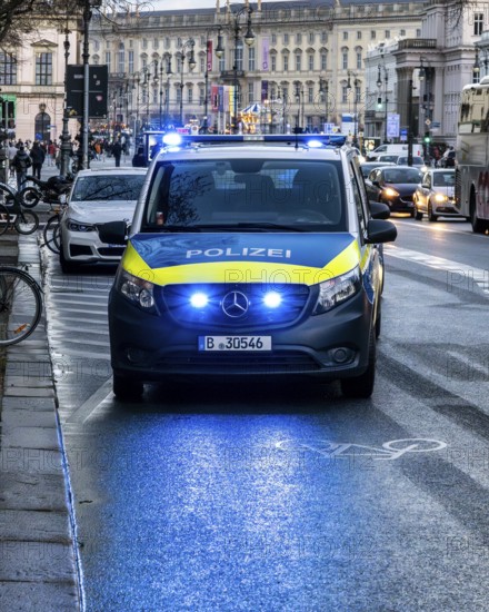 Police vehicles with flashing lights switched on, special operation at the Berlin State Library,