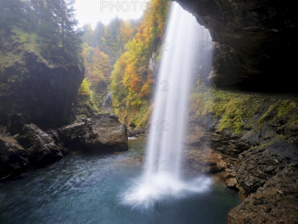 Waterfall mountain list in autumn-colored surroundings, Linthal, Klausenpass, Canton of Glarus,