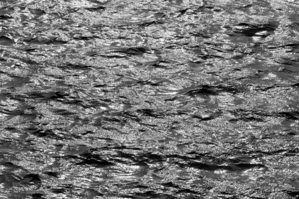 Water surface with waves and light reflections, black and white, Möhnesee, Möhnetalsperre, North