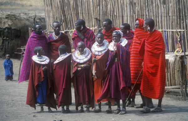 Maasai men and girls in their village in Ngorongoro Crater, Tanzania, Africa, June 2000, vintage,