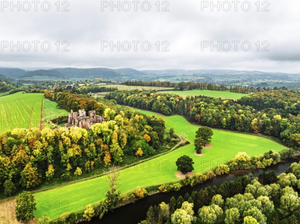 Autumn Colours over ruins of Goodrich Castle and River Wye from a drone, Goodrich, Herefordshire,