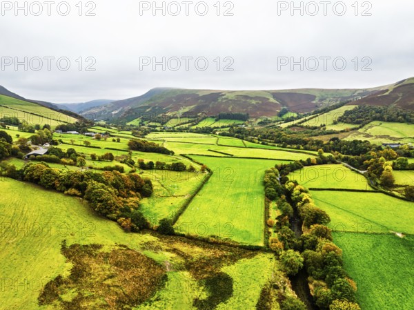 Autumn colours of Farms over River Wye and Road A470 from a drone, Llanidloes, Powys,
