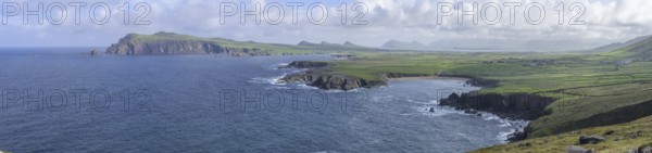 Coast with cliffs in the background An Triúr Deirféar (The Three Sisters), Clogher, Kerry, Ireland