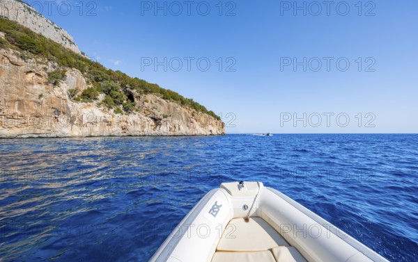 Motorboat trip along the picturesque rocky coast, cliffs and blue sea, Golfo di Orosei, Baunei,