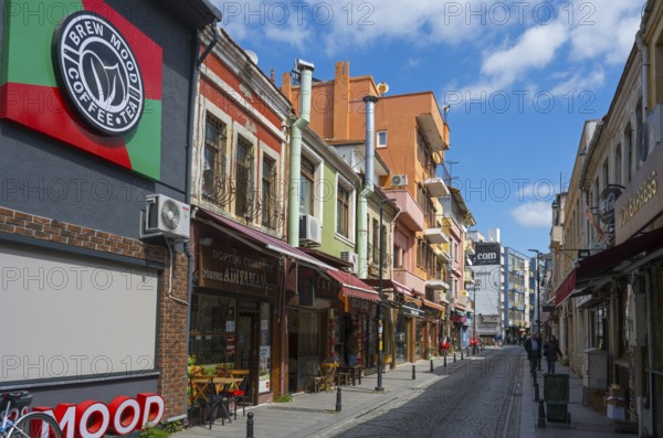 Colourful buildings along a busy shopping street on a sunny day, Yali Street, Canakkale, Marmara