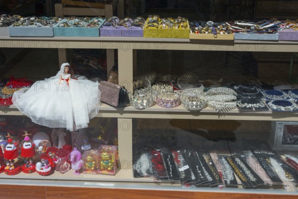 Shop window with a bridal doll and a variety of jewelry and decorations, Çanakkale, Canakkale,