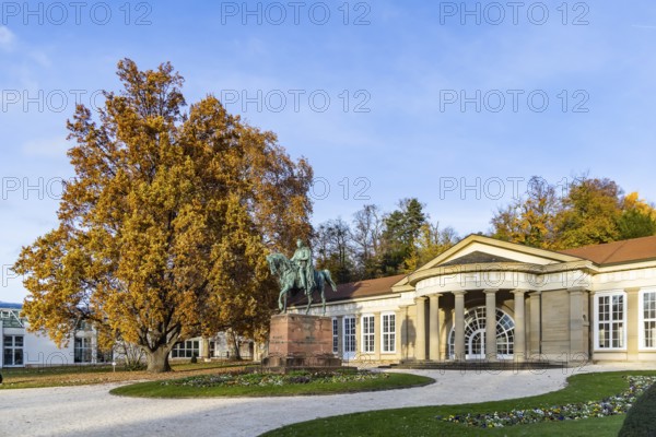 Spa garden Bad Cannstatt in autumn. Large Kursaal with equestrian sculpture of Wilhelm I Stuttgart,