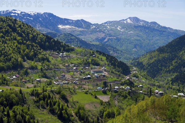 A picturesque village surrounded by alpine hills offers impressive views, village in the Lesser