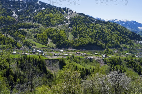 Dense forests on mountains with a small village away from the hustle and bustle, village in the