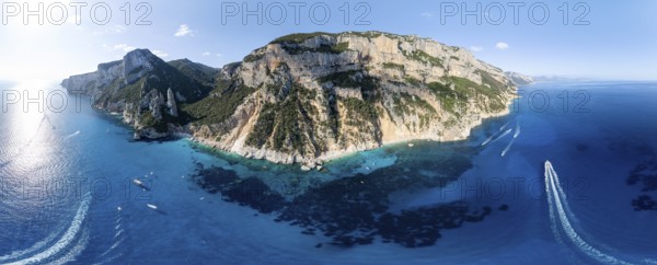 Panorama, picturesque rocky coast, cliffs with L'Aguglia pinnacle, blue sea and Cala Goloritzé