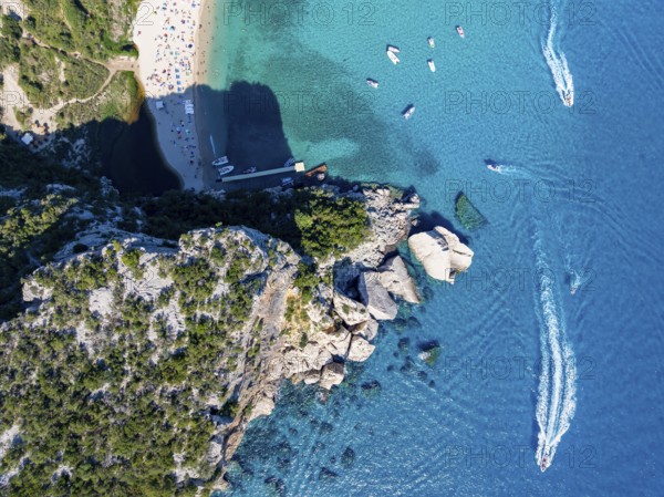 Picturesque rocky coast, cliffs and Cala Luna beach, aerial view, top-down, Golfo di Orosei,
