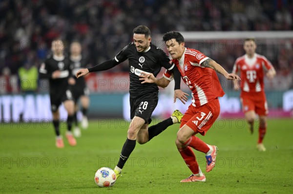 Duel, action Min-jae Kim FC Bayern Munich FCB (03) against Mathias Pereira Lage FC St. Pauli (28)