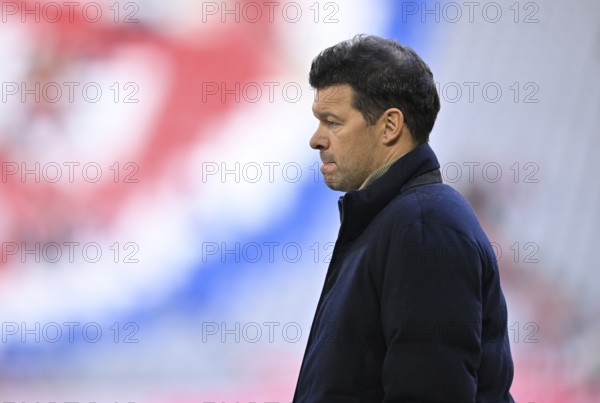 TV expert Michael Ballack in front of Logo FC Bayern Munich, thoughtful Allianz Arena, Munich,