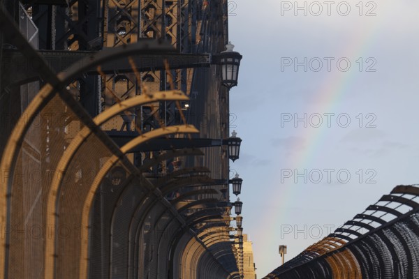 Details of the famous Sydney Harbour Bridge in the evening light with a rainbow. New South Wales,