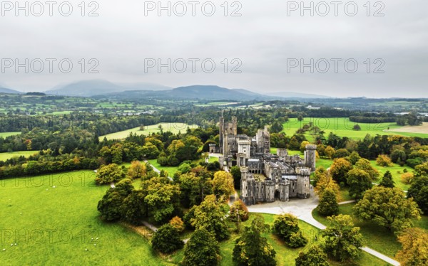 Autumn colours over Penrhyn Castle and Garden from a drone, Llandygai, Bangor, Gwynedd, North