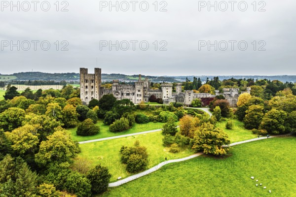 Autumn colours over Penrhyn Castle and Garden from a drone, Llandygai, Bangor, Gwynedd, North