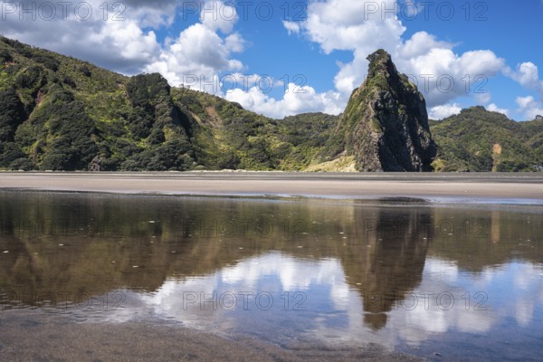 Landscape in New Zealand with sandy beach. Karekare Beach and The Watchman Rock. Karekare,
