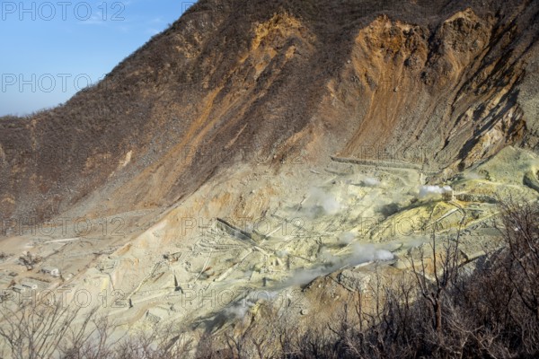 Steaming fumaroles in the Owakudani geothermal area at Komagatake volcano, Hakone, Japan