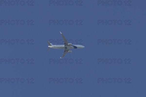 Boeing 737 jet passenger aircraft of El Al Israel airlines flying in a blue sky, England, United