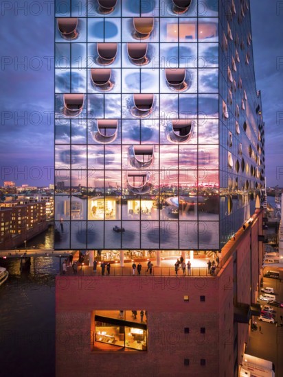 Aerial view of the Elbe Philharmonic Hall with reflections on the façade in the evening light above