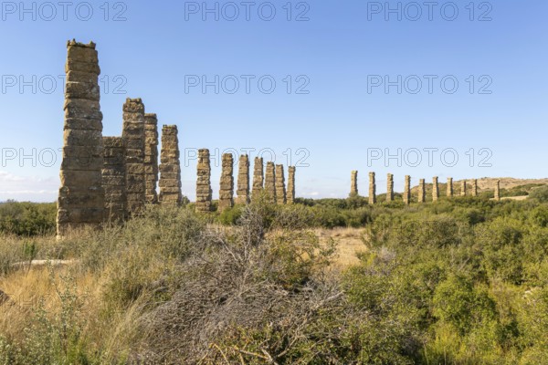 Stone columns of ancient aqueduct, Roman site of Los Banales, near Layana, Zaragoza province,