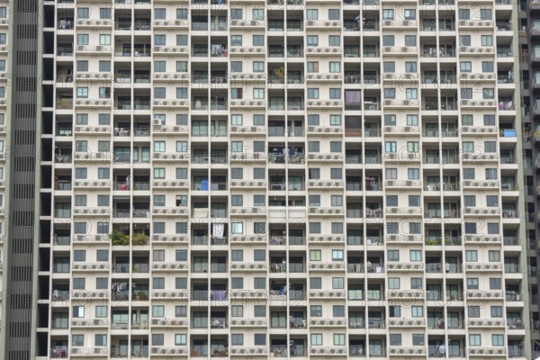 Exterior façade of a residential high-rise building of Condo U (a brand or series name of the Thai
