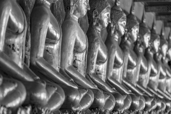 Gilded Buddha statues (Bhumispara mudra: Buddha Gautama at the moment of enlightenment), Wat Suthat