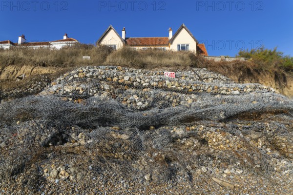 Clifftop houses at risk from coastal erosion, Thorpeness, Suffolk, North Sea coast, England, UK