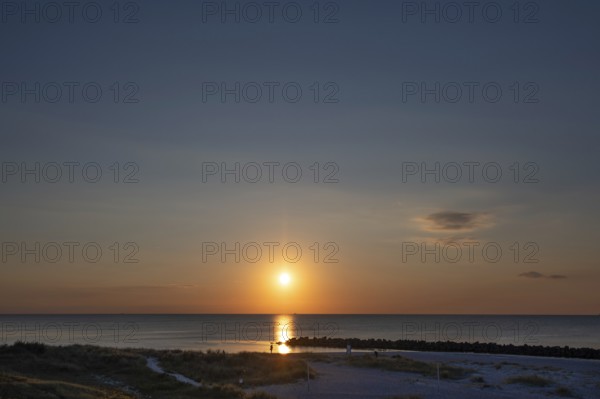 Sunset on the Baltic Sea with protective breakwaters, Darß, Ahrenshoop, Mecklenburg-Western