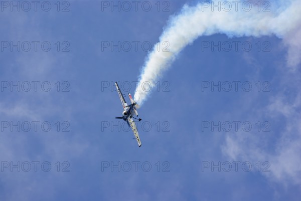 A Jakovlev Jak-55 with the registration LY-AGL during a flight demonstration as part of an air show