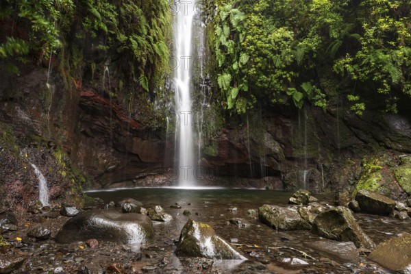 A large waterfall and many small watercourses pour down onto the rocks in the mystical 25 Fontes