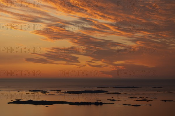 Offshore islands and skerries, sea, dramatically illuminated clouds, sunset, Otroya or Otrøya