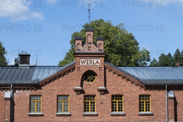 Brick façade with inscription Werla, former paper factory and mill for the production of groundwood
