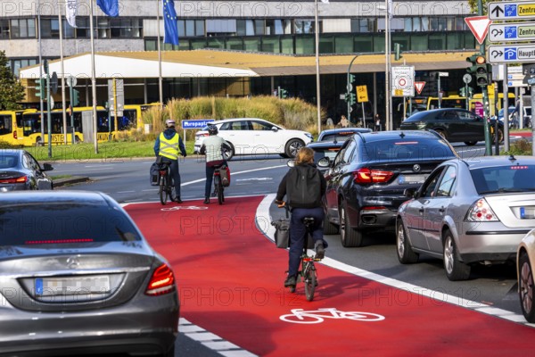 Cycle path, cycle lane, marked in red to draw the attention of motorists to the cycle path, between