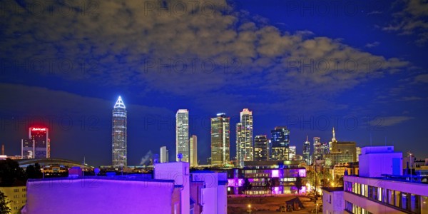 Rooftop day with colourfully illuminated houses for a techno party on the roof with a view of the