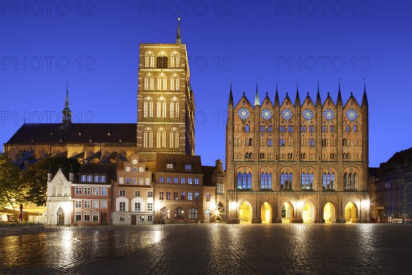 Night view, left back St. Nikolai Church first mentioned 1276, 102 metres high, front left, white,