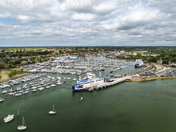 Wight Light car ferry to Isle of Wight on Lymington River and marina from drone, Lymington, New