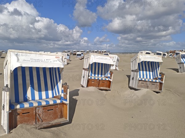 Sand drifts on the North Sea beach, blue sky, white clouds, summer, sun, sand, beach chairs, on the