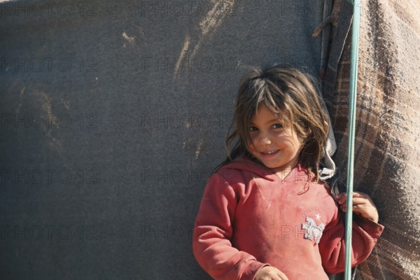 Syrian children playing in a refugee camp near the Turkish border on World Children's Day. Aleppo,