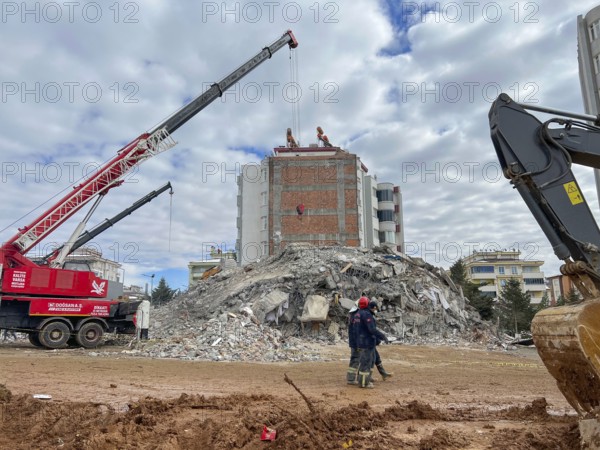 Turkish civil defense teams (AFAD) search for survivors under the rubble after a powerful 7