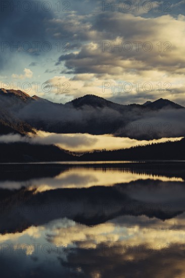 Sunrise with reflections in the Plansee in Tyrol in the Alps in Austria